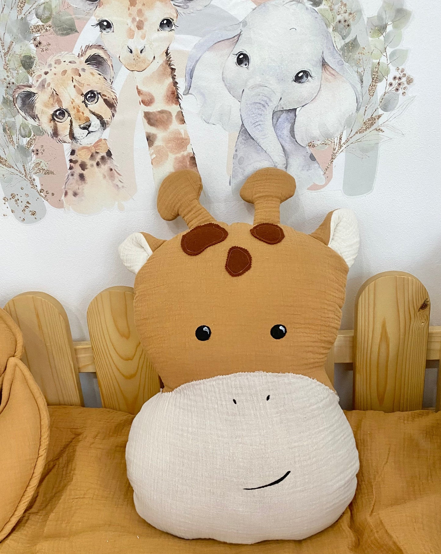 Giraffe pillow in toddler reading nook