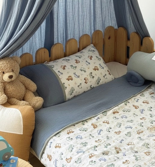 Handmade cotton muslin toddler duvet cover set with cars print styling on wooden Montessori kids bed