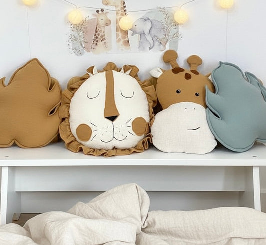 Safari nursery pillow set on shelf