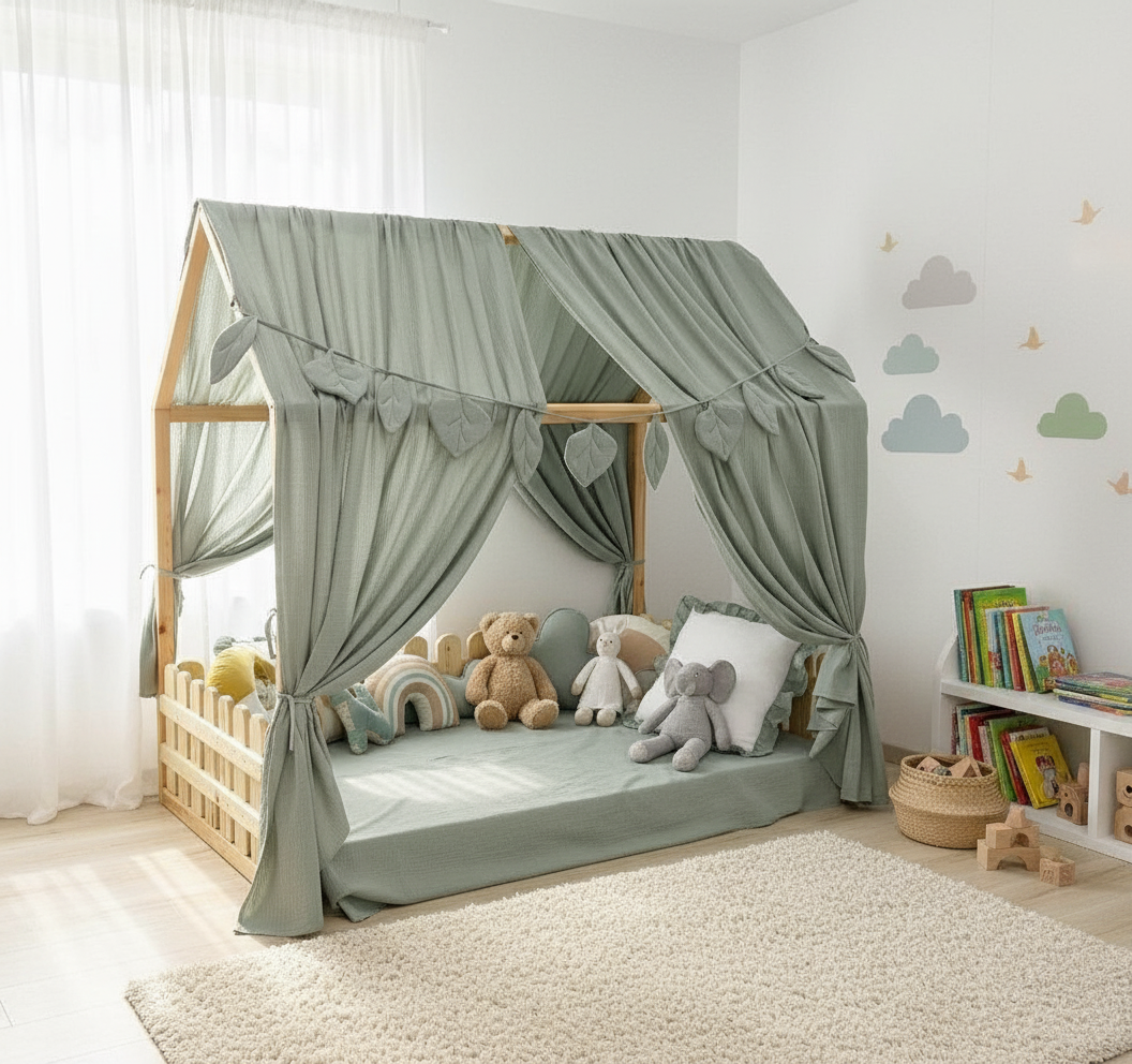 Sage green canopy over floor bed in kids room
