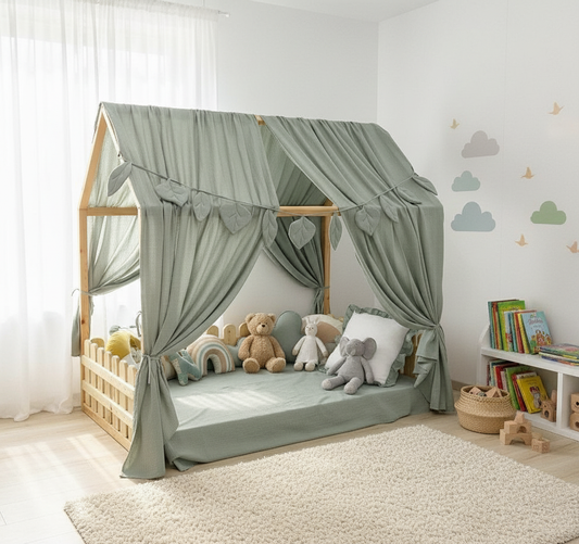 Sage green canopy over floor bed in kids room