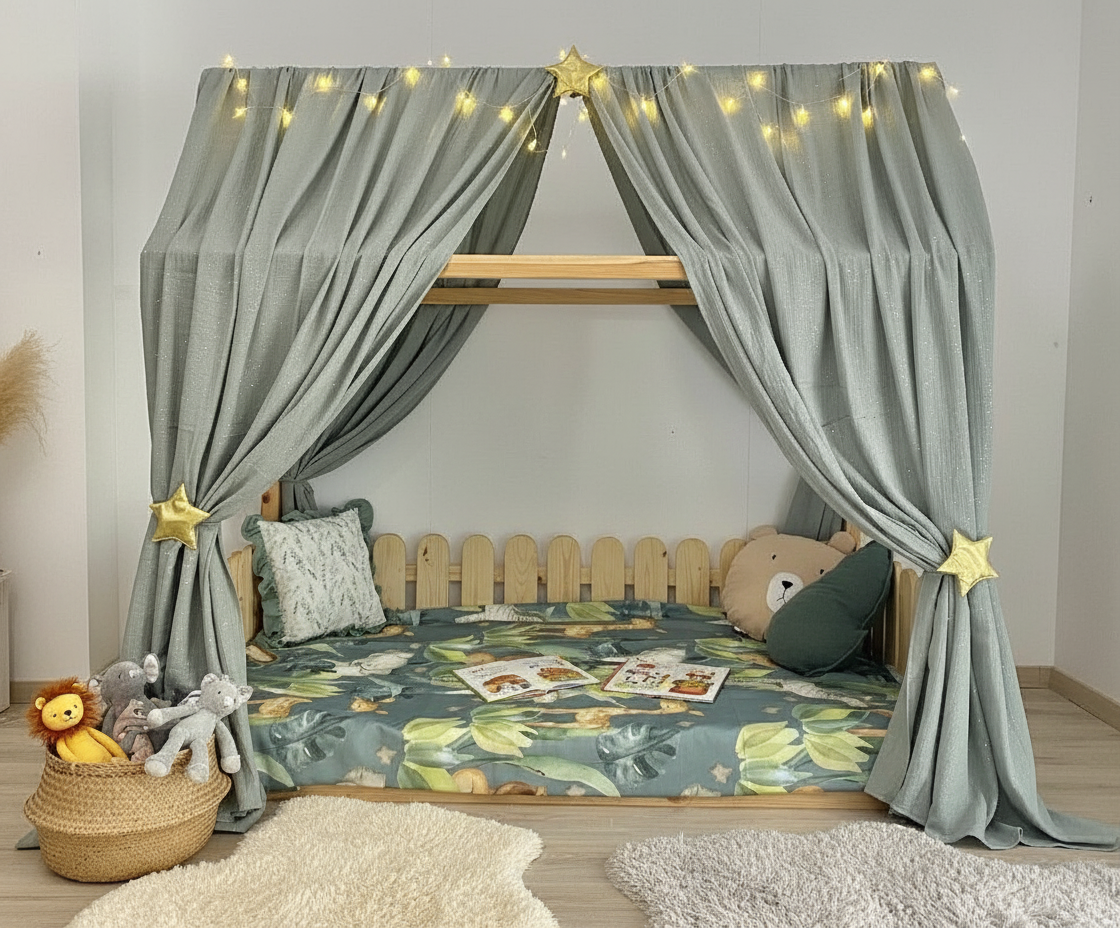 Sage grey canopy over Montessori floor bed with star tiebacks