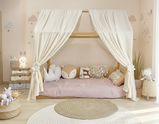 Cream canopy draped over Montessori floor bed