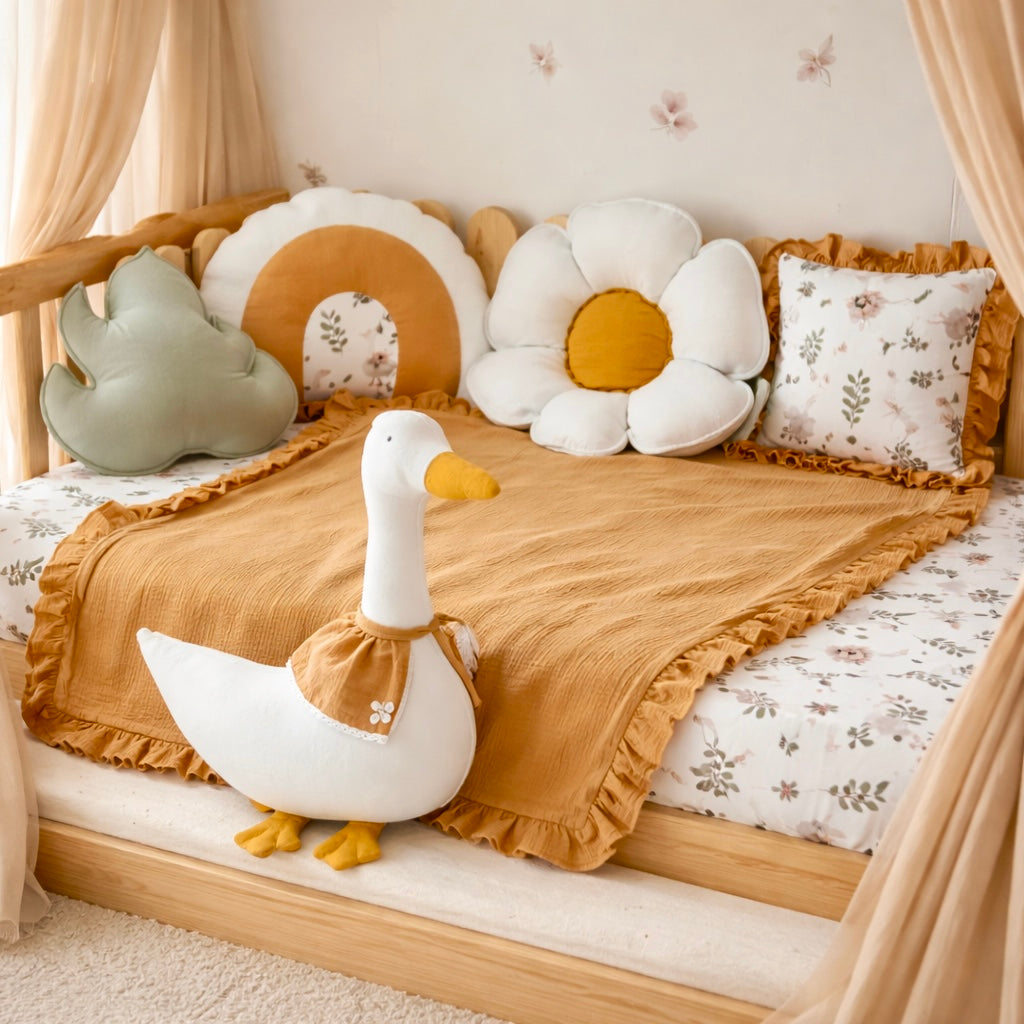 Children's room with a bed decorated with soft pillows and a large toy duck.